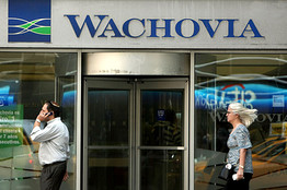 People walk by a Wachovia branch in New York City